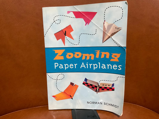 Zooming Paper Airplanes by Norman Schmidt