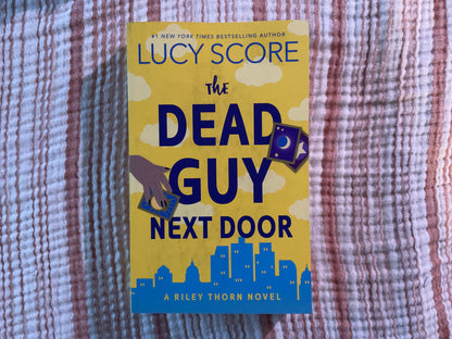 The Dead Guy Next Door by Lucy Score (Riley Thorn #1)
